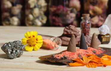 Incense Cones on Stone Slab With Crystals and Flowers