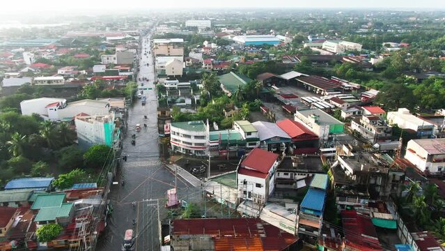 Aerial view of vehicles driving through long flooded highway from Dagupan City, Philippines