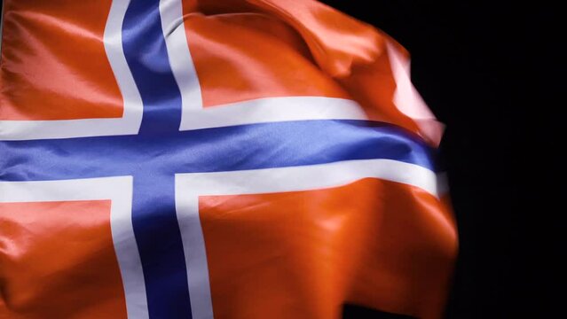 National Norwegian Flag. Black background.
Norwegian flag is waving.
