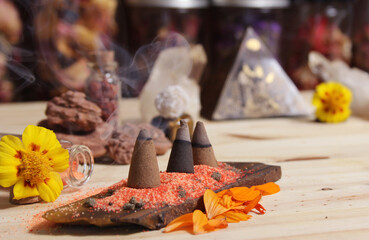 Incense Cones on Stone Slab With Crystals and Flowers