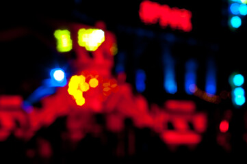 Abstract random colourful defocused blurred night life of fun fair background pattern