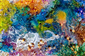 Dark and light golden dust on Alcohol ink fluid abstract texture fluid art with gold glitter and liquid.