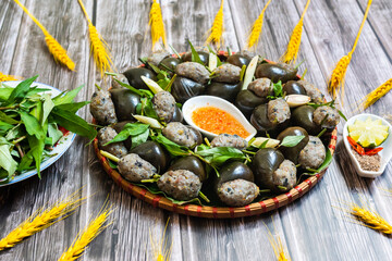 Steamed snails with lemongrass ( Oc doi hap xa).  The ingredients include ground pork, pork leg,...