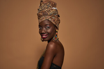 Side view of smiling black girl looking at camera