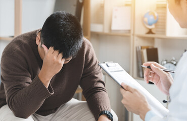 A doctor or psychiatrist care and consults a patient who has mental stress for diagnostic...