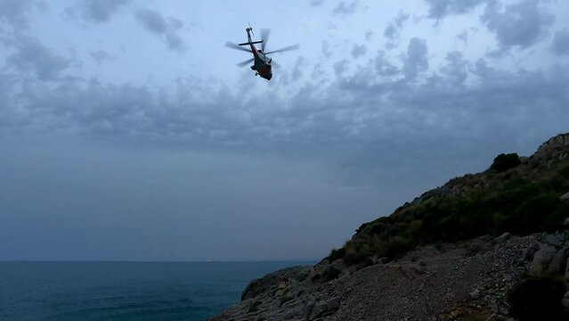 OROPESA DEL MAR, SPAIN - JUNE 2022: Marine rescue helicopter doing a search and rescue drill