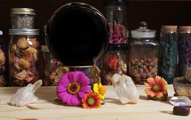 Meditation Altar With Rock Crystals and Flowers. Jars of Herbs in Background