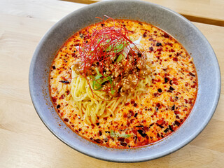 Fire spicy red minced pork tan tan ramen Japanese noodle soup served hot
