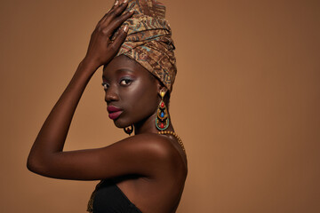 Side of stylish black girl wearing african outfit
