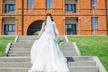 Fototapeta premium Bride in a white dress. Wedding photo of the bride