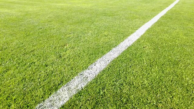 Corner pitch. Soccer, Football field grass. Close up of the lines and grass on a soccer pitch.

