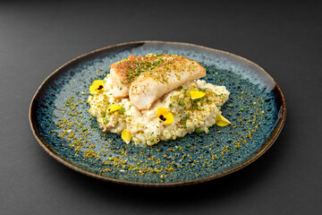 risotto with yellow flowers and whitefish