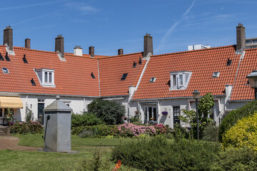 View of Zandvoort national monument: Gasthuishofje (Guest house courtyard) - first structure in Zandvoort's reconstruction plan. Zandvoort, North Holland, the Netherlands. - obrazy, fototapety, plakaty