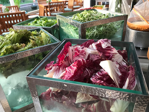 Outstanding glass boxes of variety salad vegetables.