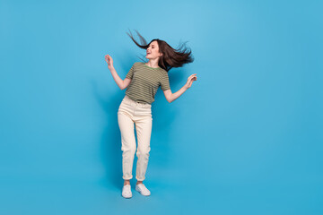 Full body photo of cute young brunette lady dance look promo wear casual cloth isolated on blue background