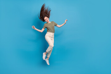 Full body photo of cool millennial brunette lady jump wear casual cloth isolated on blue background