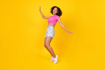 Fototapeta na wymiar Full size portrait of positive cheerful person dancing partying have good mood isolated on yellow color background