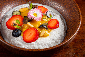 Rice pudding. french milk rice dessert with raspberries, blueberries, berries