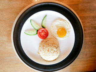 fried egg with rice and vegetables