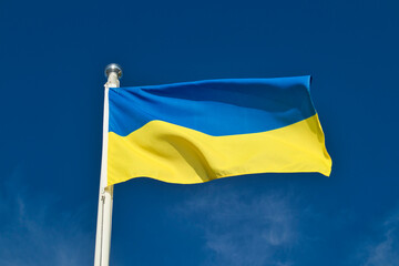 flag of Ukraine against blue sky
