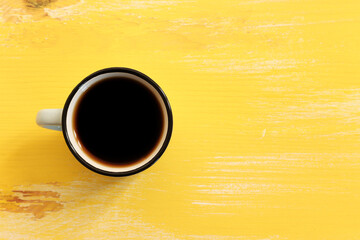Fototapeta Top view image of coffee cup over wooden table background. obraz