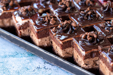 Chocolate tartlet. Small chocolate cake, fresh out of the oven, in a tray. close up