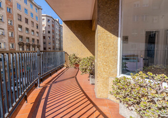 Fototapeta na wymiar Large balcony in a block of buildings in a big city like Barcelona