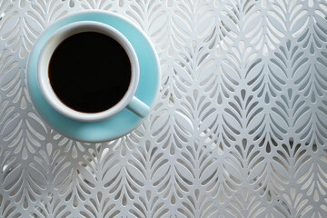 A americano coffee is served on the white table. - 522234601