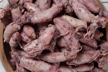 Naklejka premium Cumi Asin mentah or raw fresh salted squid or salted cuttle fish.