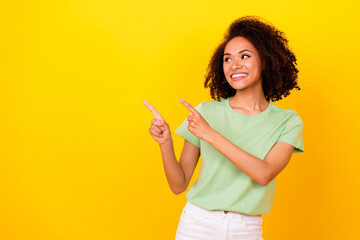 Photo of funny brunette wavy lady look index promo wear t-shirt isolated on bright yellow color background