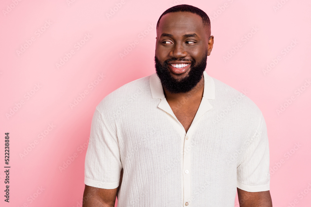 Poster photo of satisfied person beaming smile look interested empty space isolated on pink color backgroun
