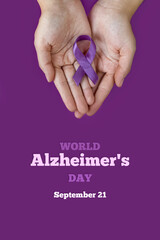 World Alzheimer's day. September 21. International Epilepsy Day. Adult hands holding purple ribbon...