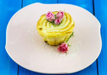 Appetizing cake tart with cream and rose