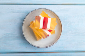 Almond milk and peach jelly on blue wooden background. top view