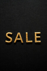 Sale - golden word on black. Online sale or clearance store concept.