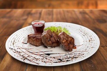 Tasty grilled beef steak on the desk background