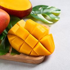 Mango background design concept. Top view Diced fresh mango fruit on white table.