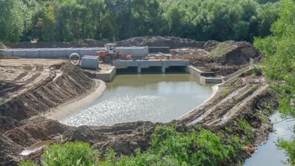 Construction of the river drains. Construction drains to prevent flooding in the city. Drain water...