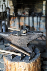 Fototapeta Large metal anvil and hammer in a vintage blacksmith. obraz