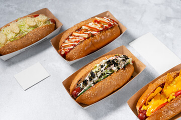 Fast food hot dog banner on a light grey stone textured background, hotdog menu template, hotdog menu mock up, free space for text, different hot dog types