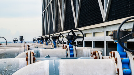 Open or close valve of cooling tower,butterfly valve beside of cooling Tower,screwing valve building cooling system,maintenance in working condition,anti-rust,rust is big problem of piping system.