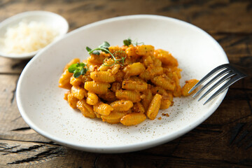 Homemade pasta with red pesto