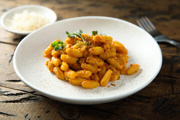 Homemade pasta with red pesto