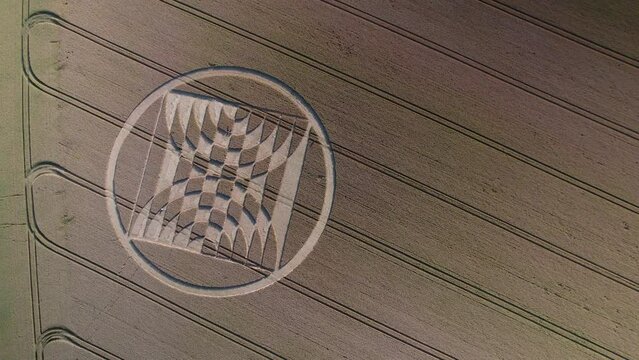 Drone aerial footage showing fake UFO crop circles on a field of grain near Micheldever Station, United Kingdom.