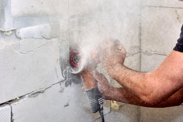 Angle grinder power tool for cut concrete with silicon carbide wheels is cutting masonry.