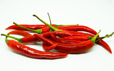 Red hot chili peppers on white background.
