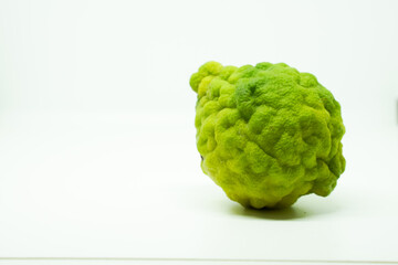 Bergamot fruit with stem and leaf isolated on white background. Clipping path.