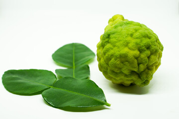 Fototapeta premium Bergamot fruit with stem and leaf isolated on white background. Clipping path.