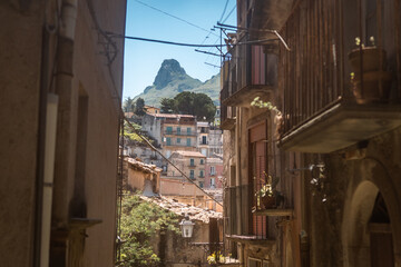 view of the old european town in summer with mountain in the background
