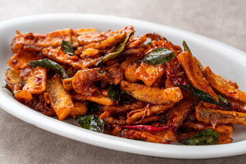 Terong goreng or fried eggplant with dried shrimps and sambal.